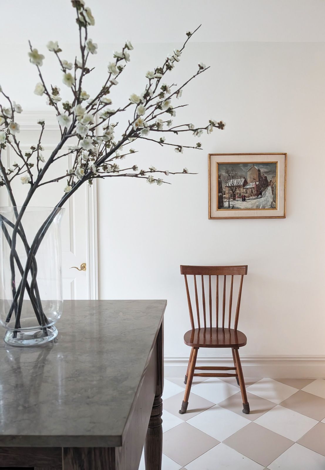 Spindle chair, antique painting and blossoms