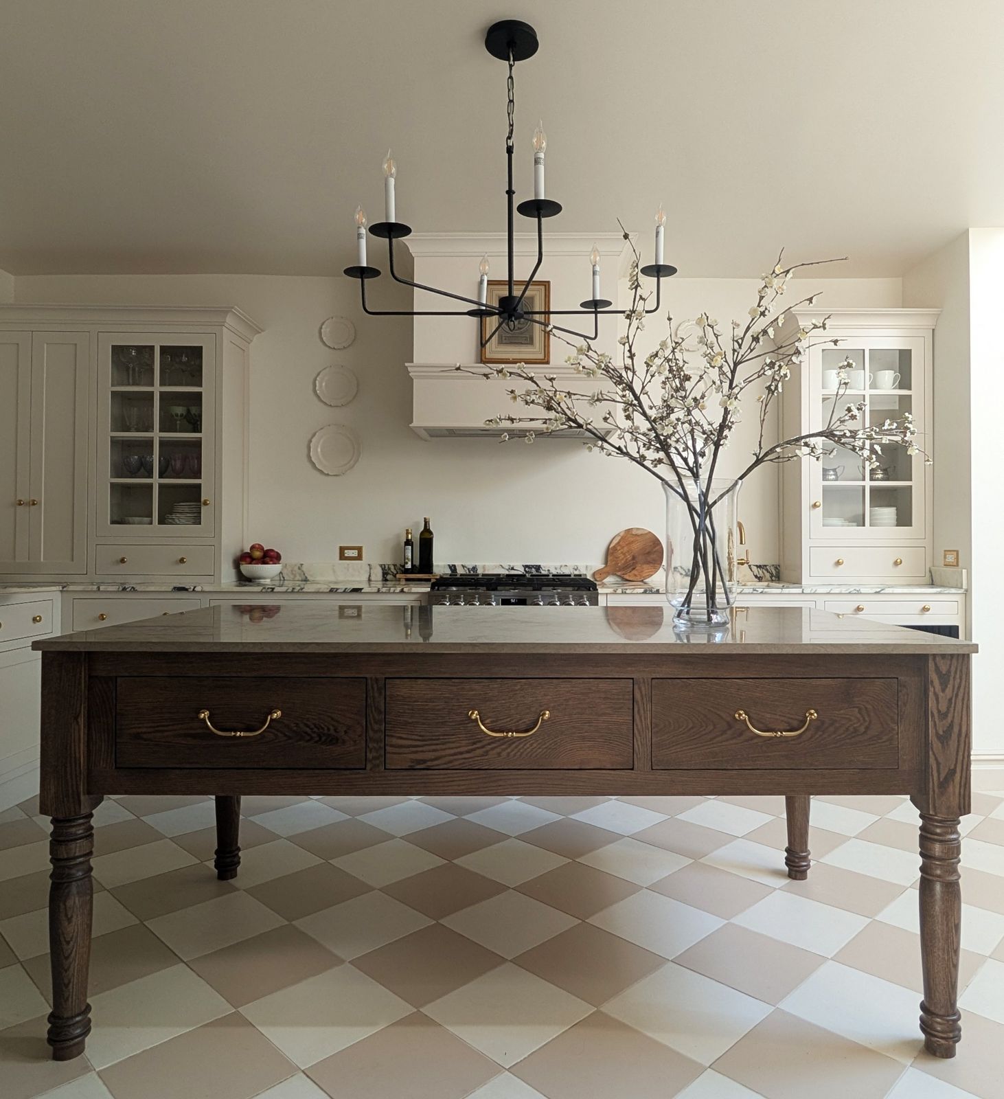 Kitchen with oak island and checkered floor