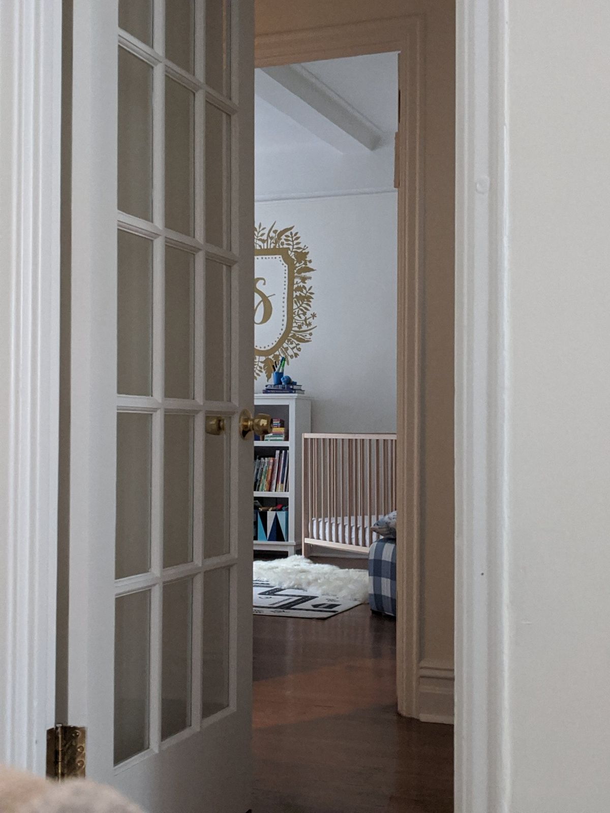 Nursery glimpsed through a glazed door